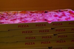 English Comedy Show with Pizza and Shots in Central Berlin - Your evening timeline: doors at 19:00, pizza at 20:15, show at 21:00